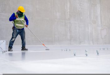 Construction,Worker,Coating,Floor,By,Epoxy